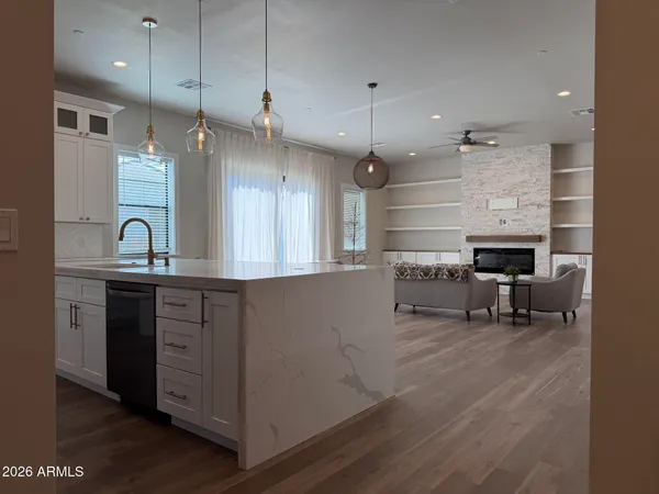 a kitchen with stainless steel appliances a refrigerator and cabinets