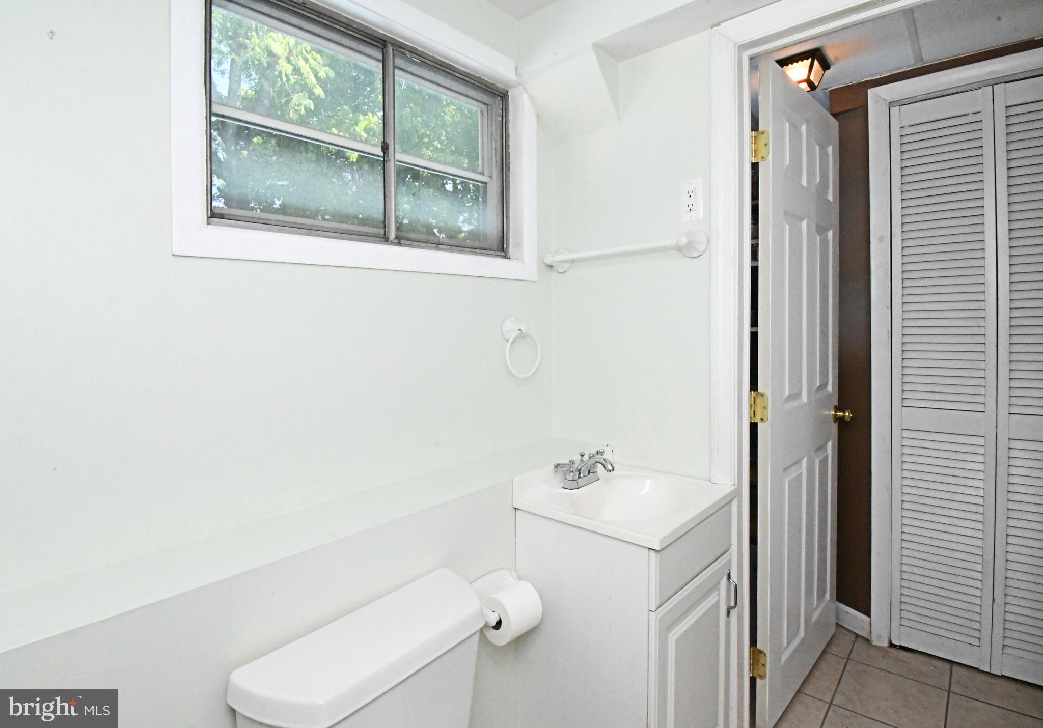 609 Mansfield Road Willow Grove, PA 19090 - Photo 42 of 68 a bathroom with a sink mirror and toilet