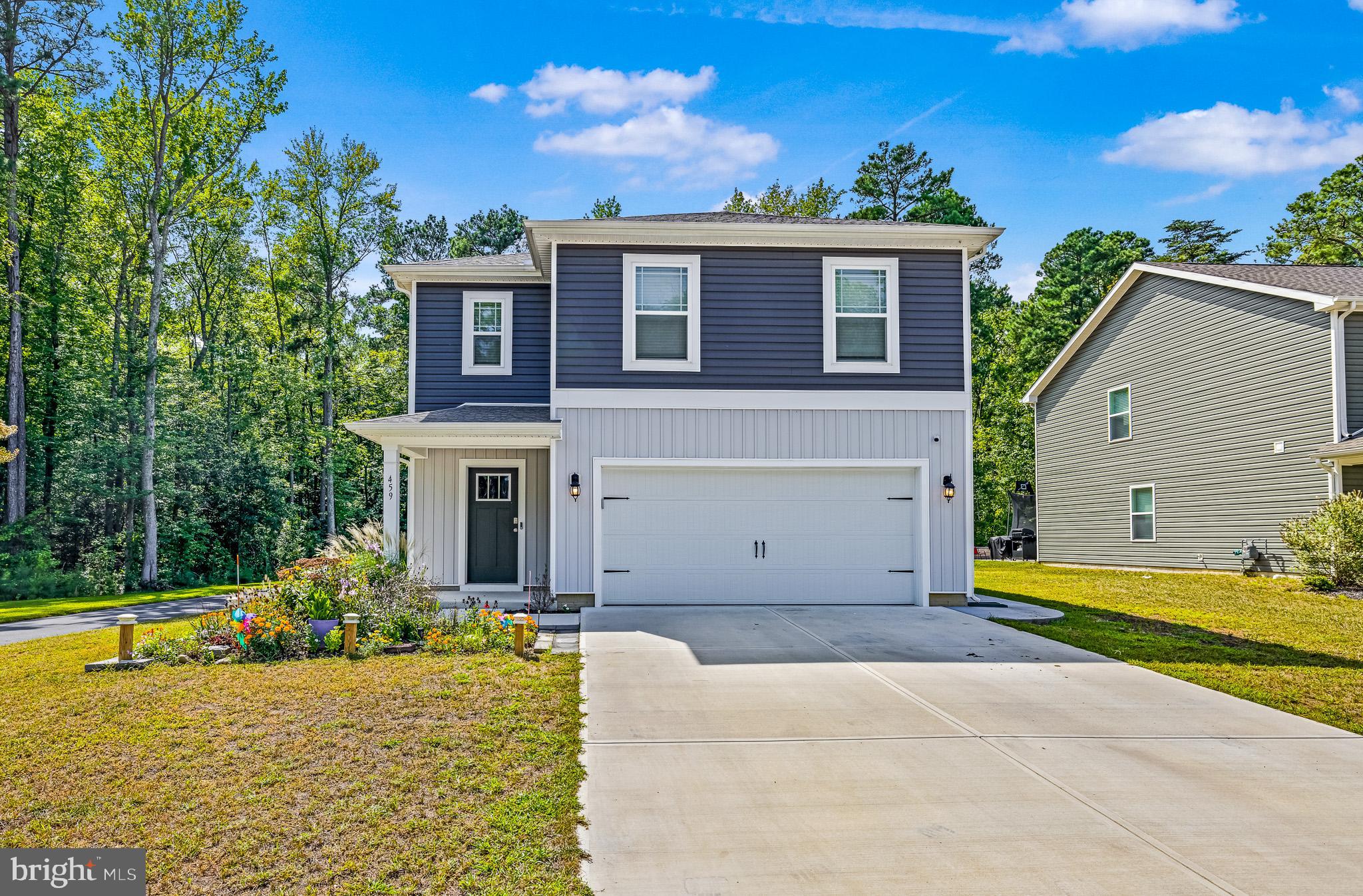 459 Currant Circle Magnolia, DE 19962 - Photo 2 of 39 a view of a house with a swimming pool and a yard