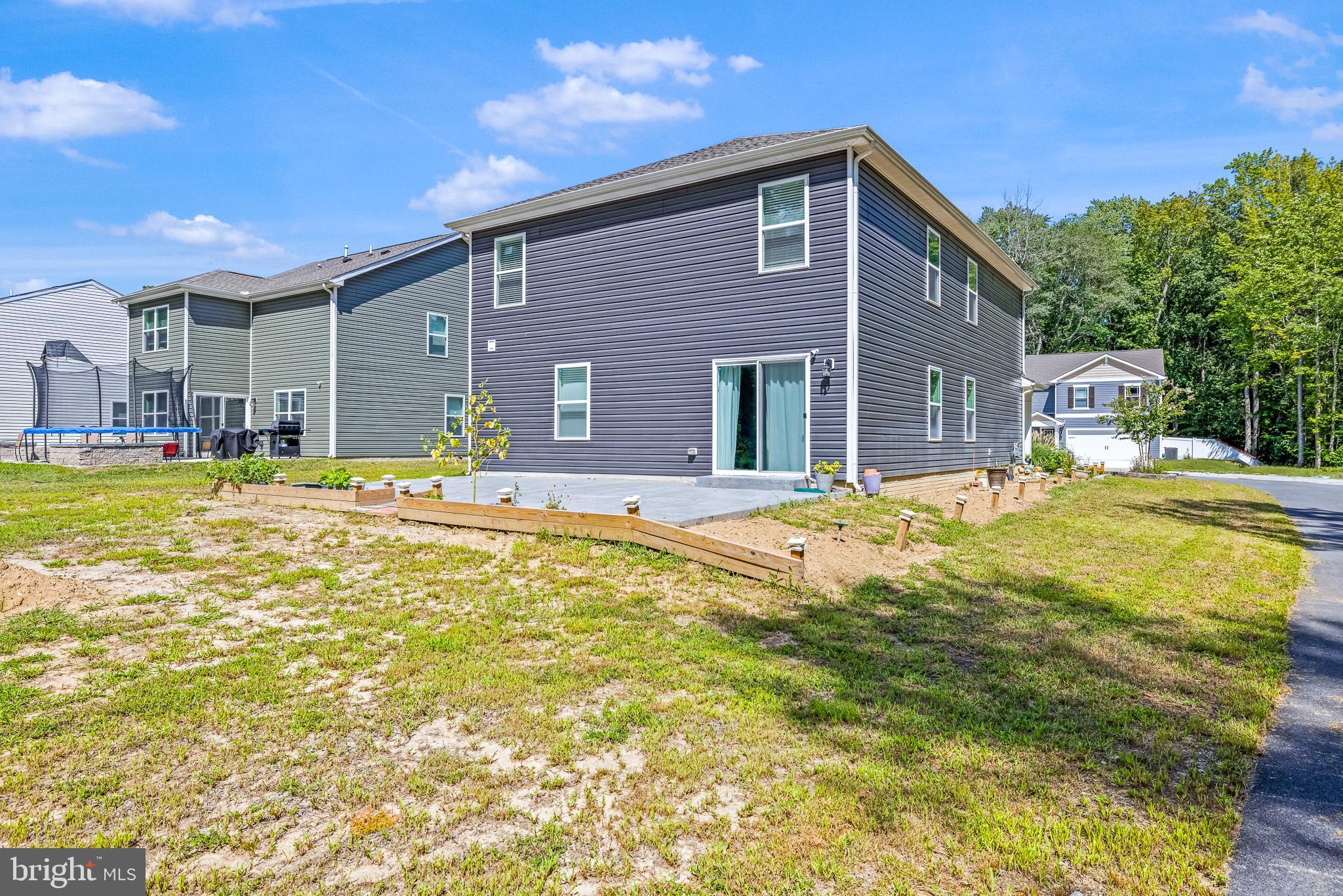 459 Currant Circle Magnolia, DE 19962 - Photo 38 of 39 a swimming pool with outdoor seating and yard