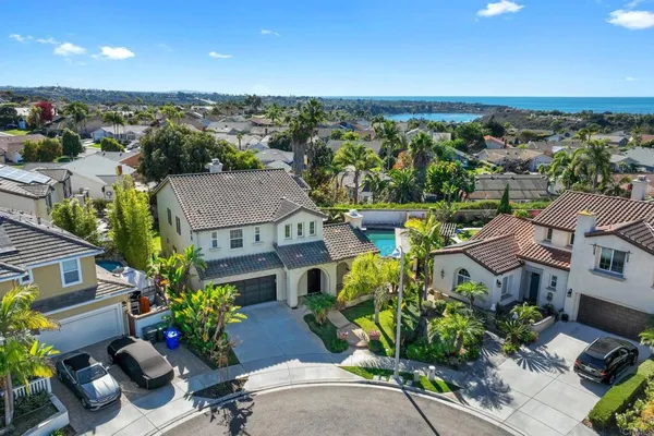 an aerial view of a house with a garden