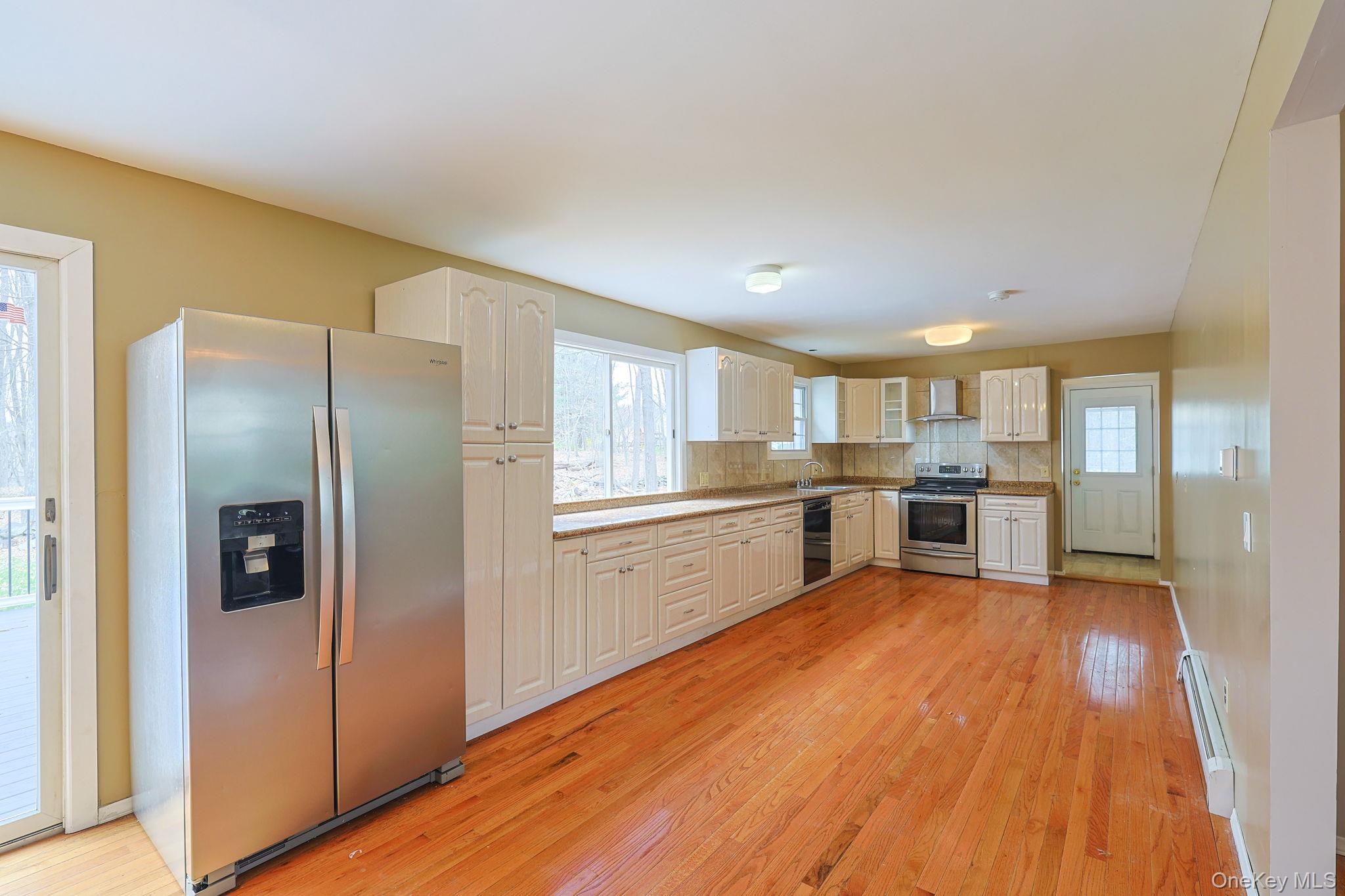 78 Pickerel Road Monroe, NY 10950 - Photo 11 of 41 a kitchen with stainless steel appliances granite countertop a refrigerator and a sink