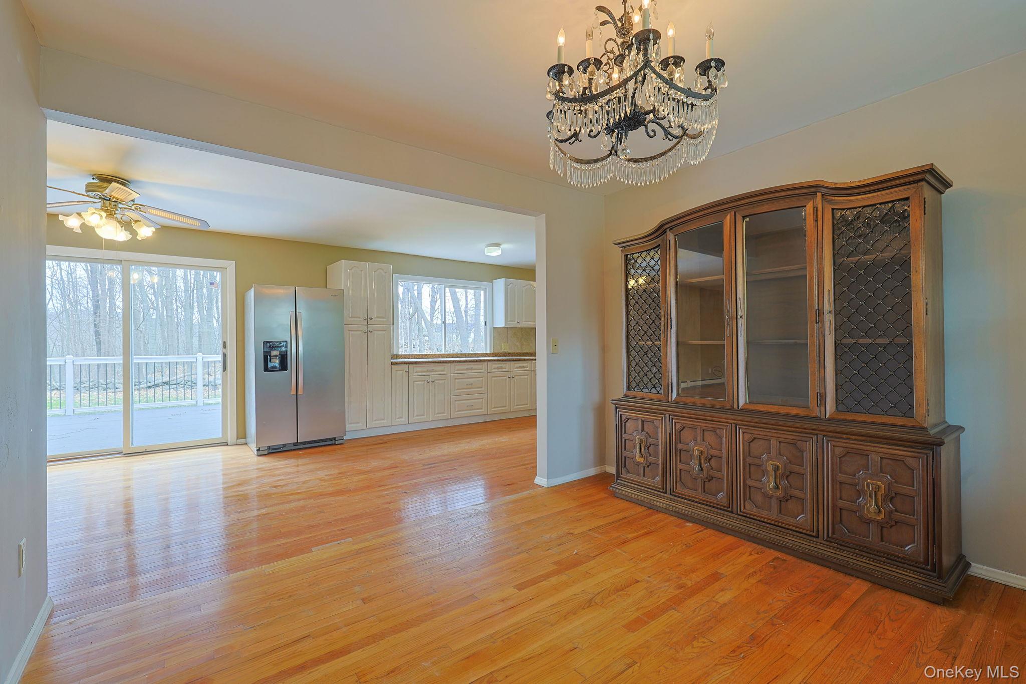 78 Pickerel Road Monroe, NY 10950 - Photo 15 of 41 a view of an empty room with wooden floor and a window