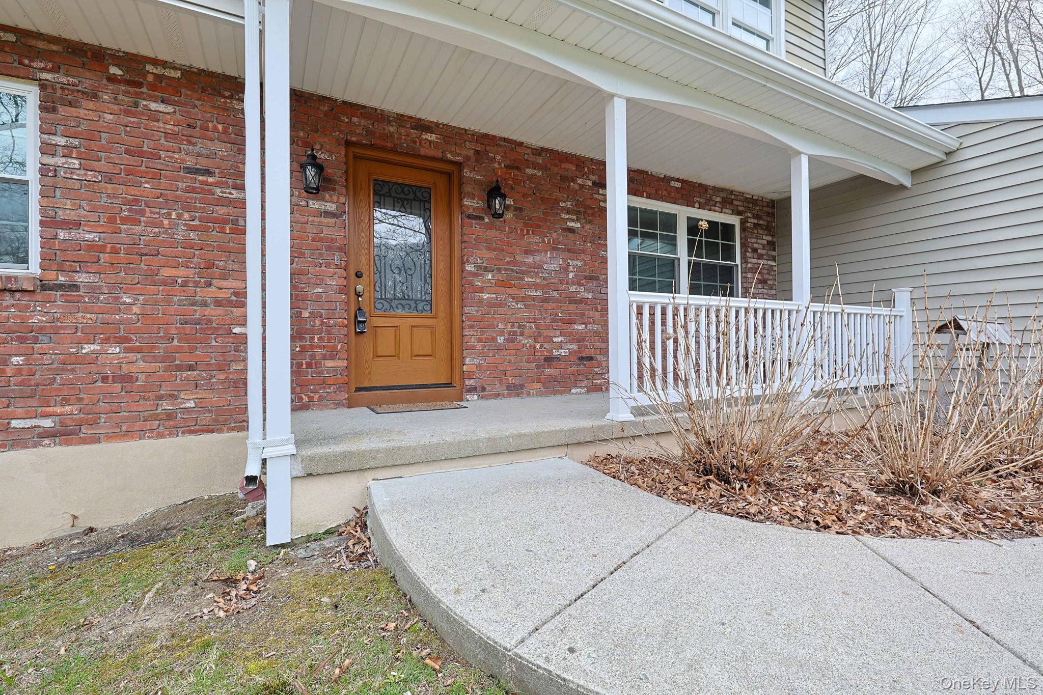78 Pickerel Road Monroe, NY 10950 - Photo 2 of 41 a view of a brick house with wooden fence