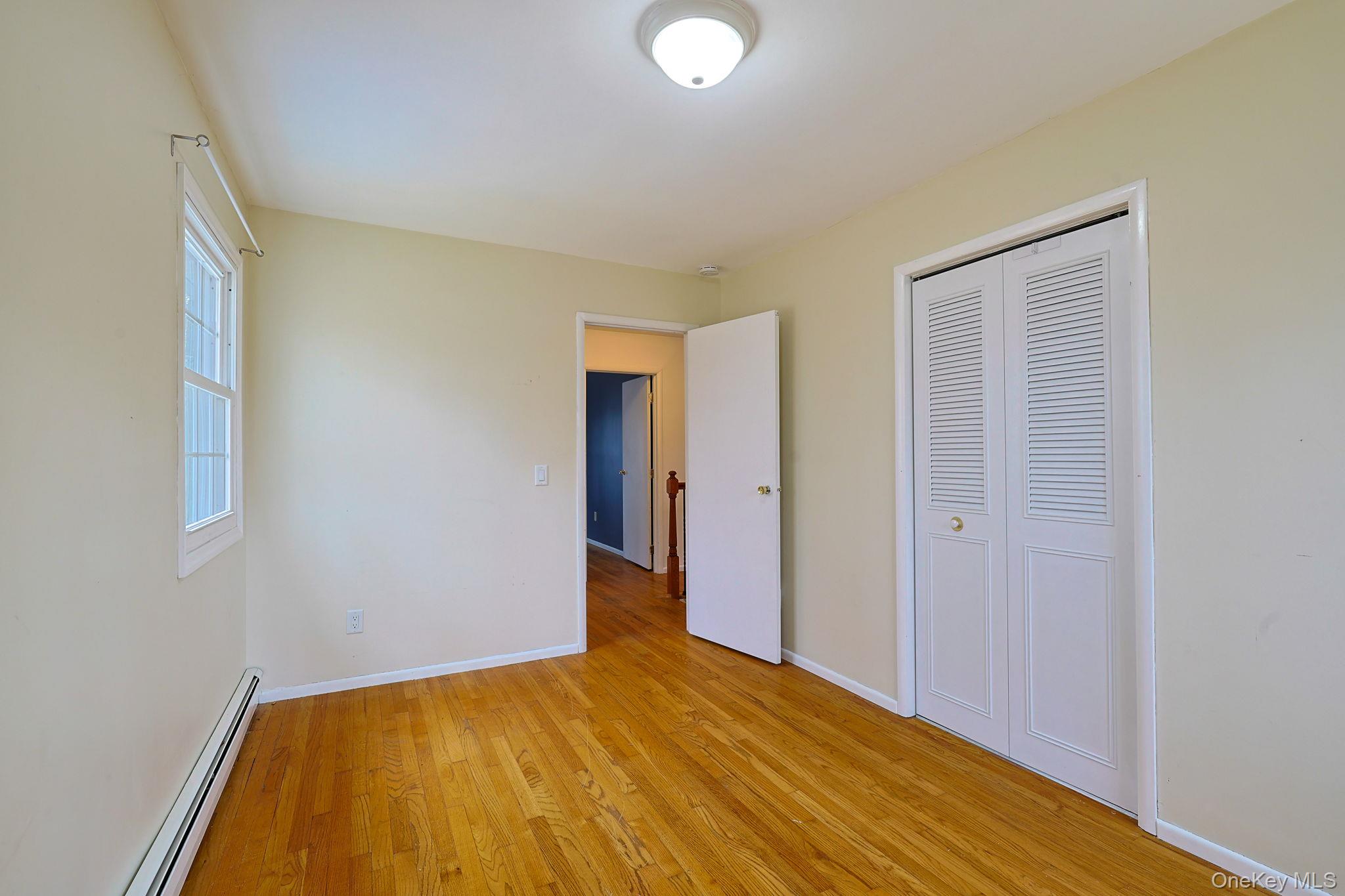 78 Pickerel Road Monroe, NY 10950 - Photo 22 of 41 a view of empty room with wooden floor