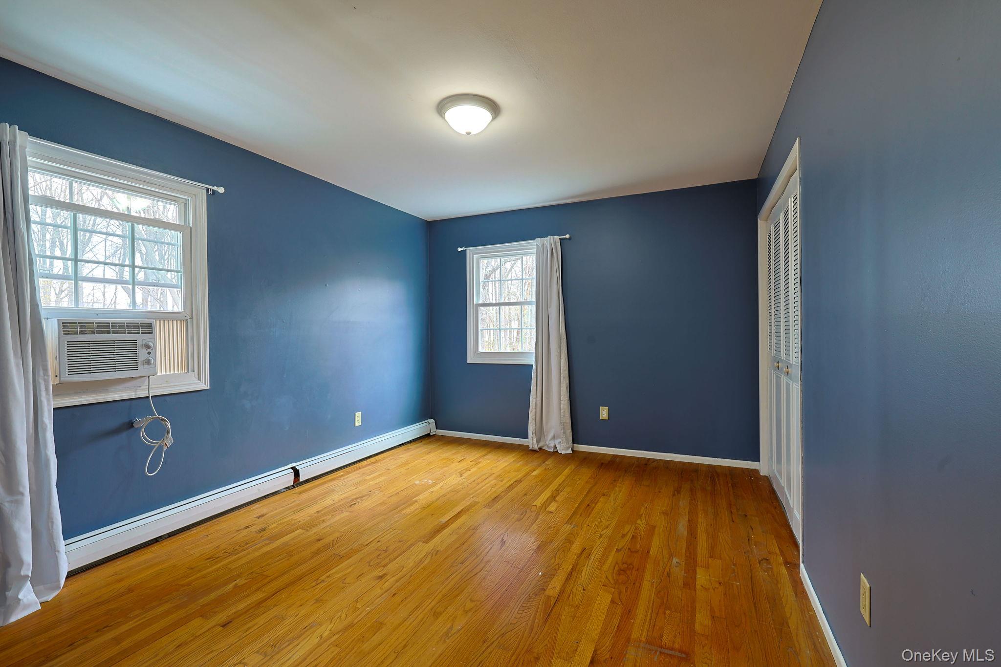78 Pickerel Road Monroe, NY 10950 - Photo 23 of 41 a view of an empty room with window and wooden floor