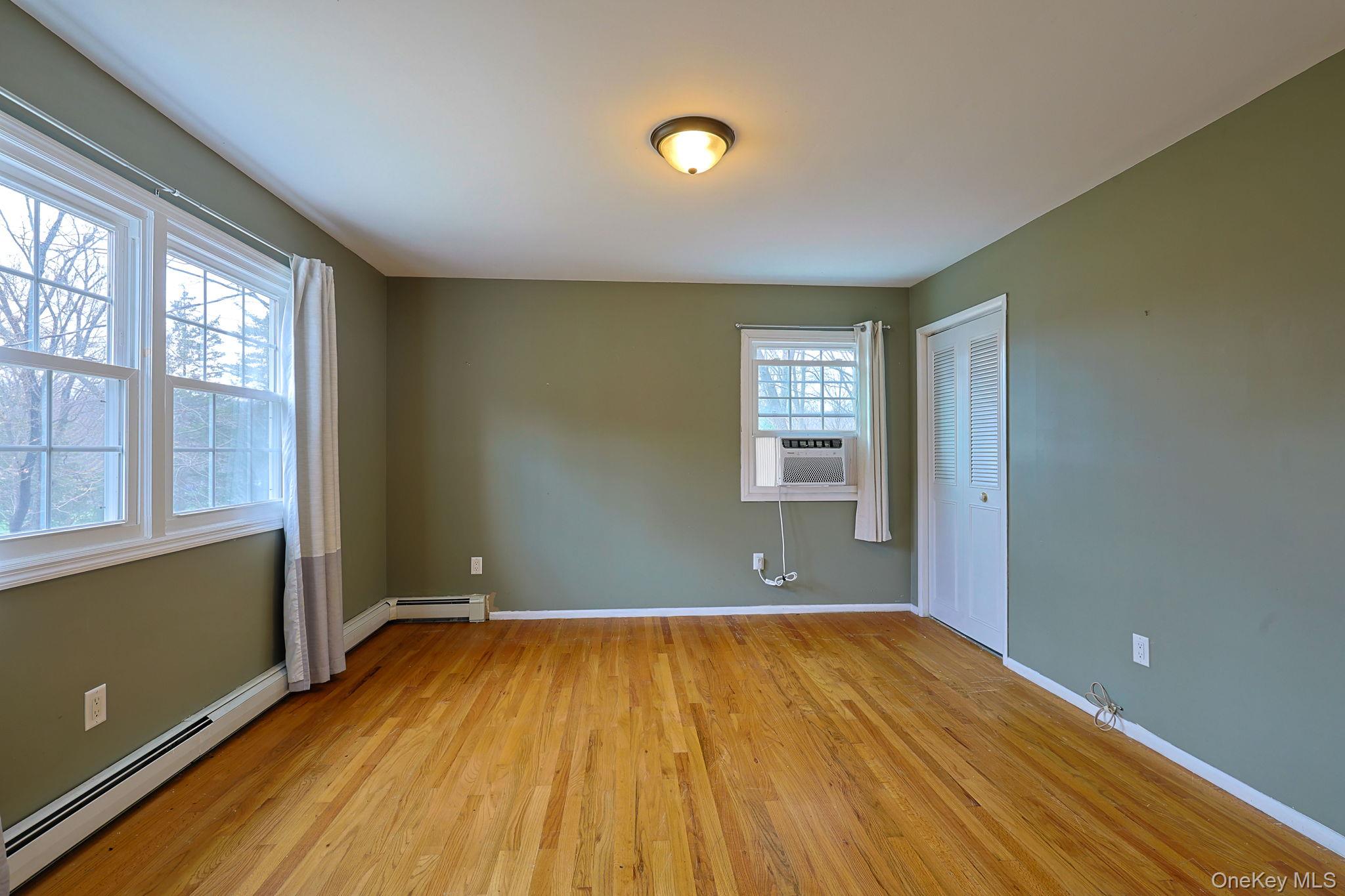 78 Pickerel Road Monroe, NY 10950 - Photo 26 of 41 wooden floor in an empty room with a window