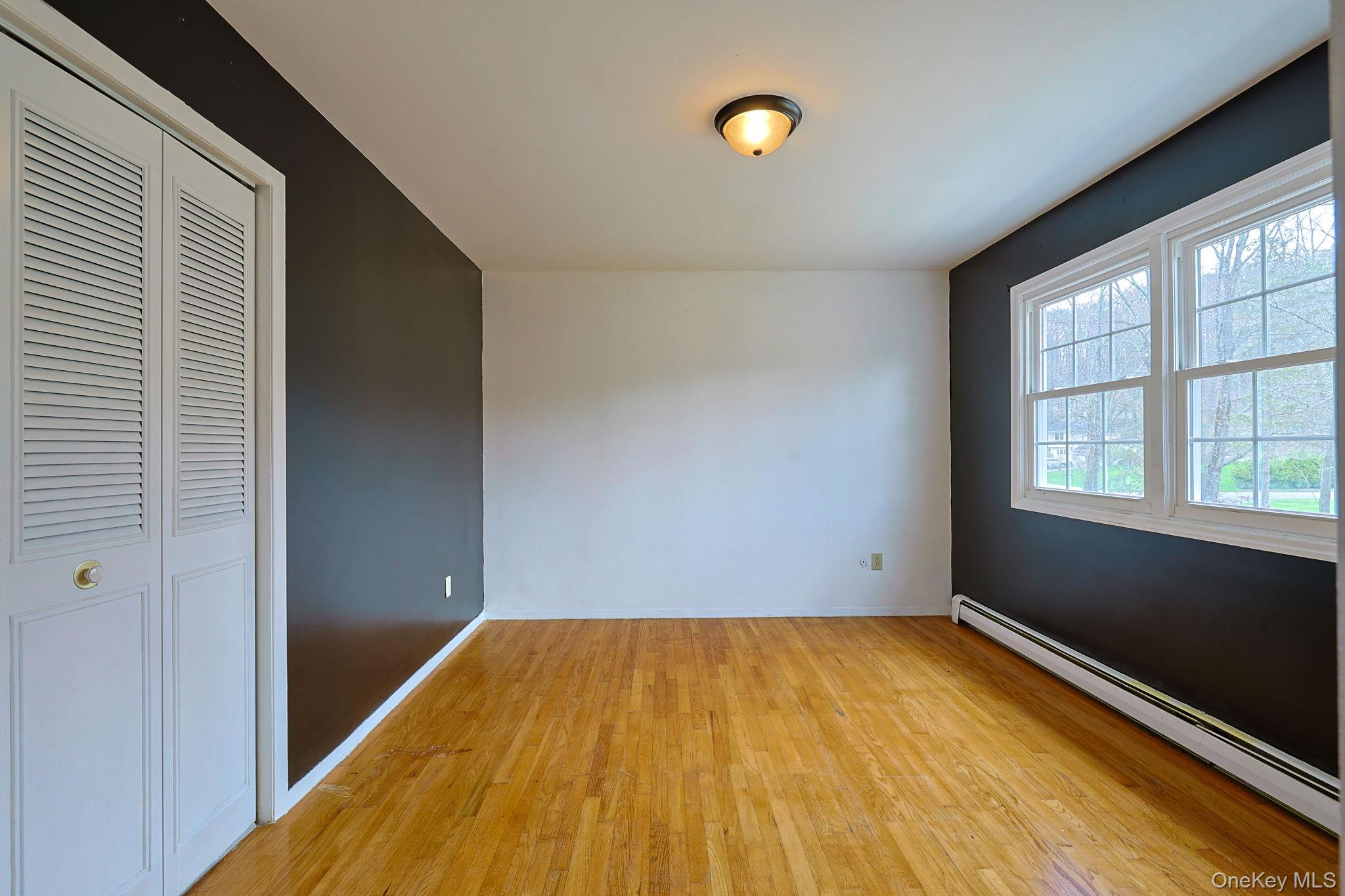 78 Pickerel Road Monroe, NY 10950 - Photo 29 of 41 a view of room with window and wooden floor