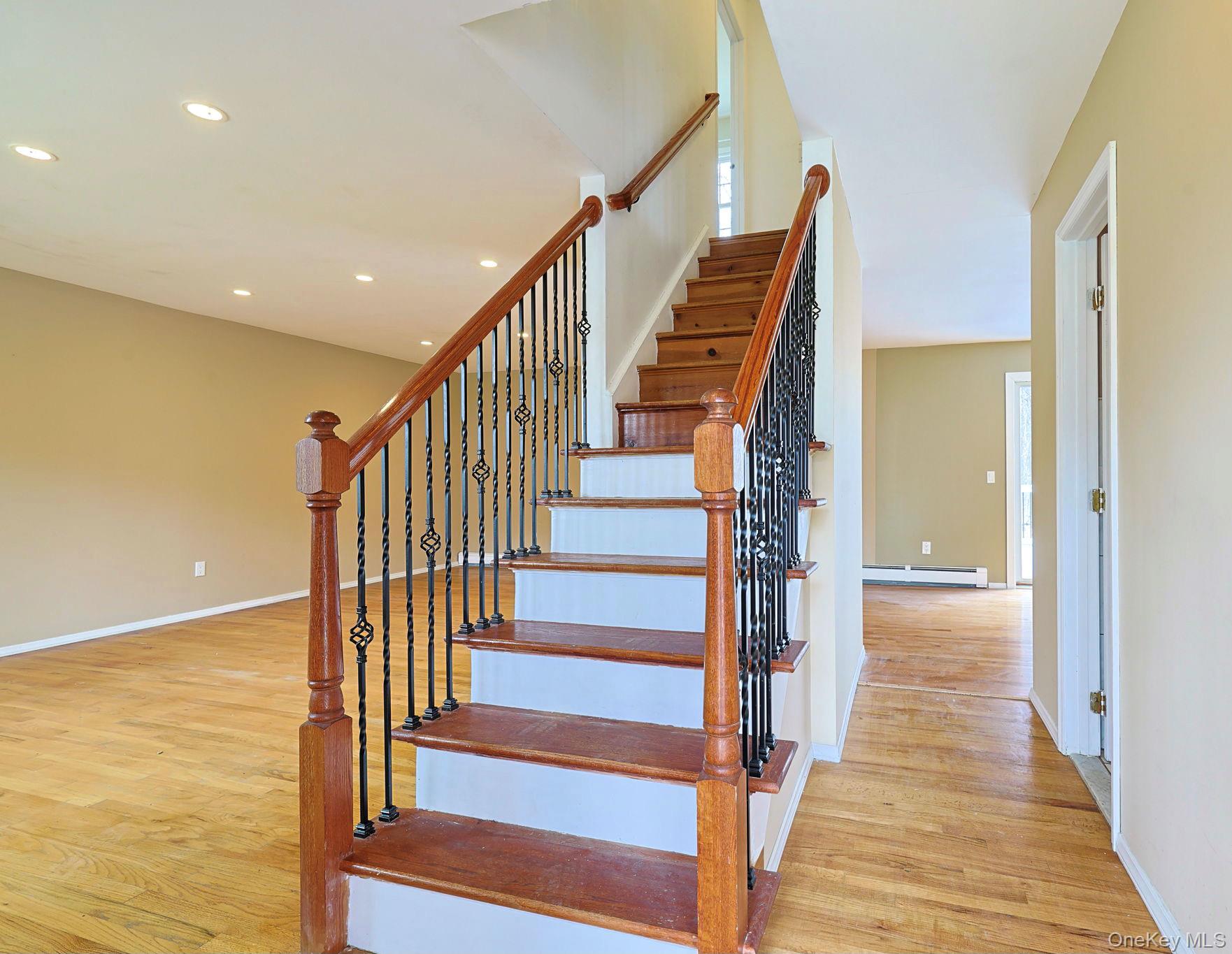 78 Pickerel Road Monroe, NY 10950 - Photo 4 of 41 a view of a hallway with wooden floor and staircase