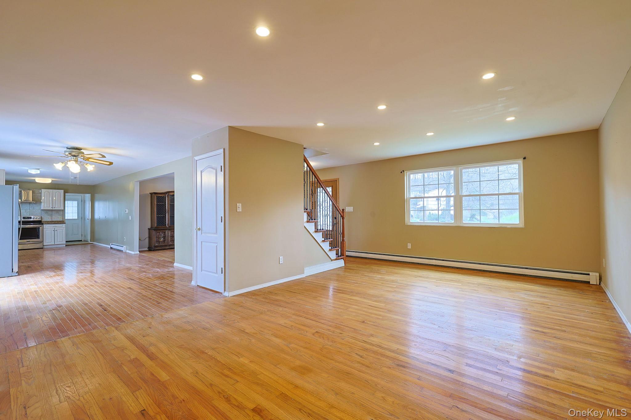 78 Pickerel Road Monroe, NY 10950 - Photo 6 of 41 a view of an empty room with wooden floor and a window