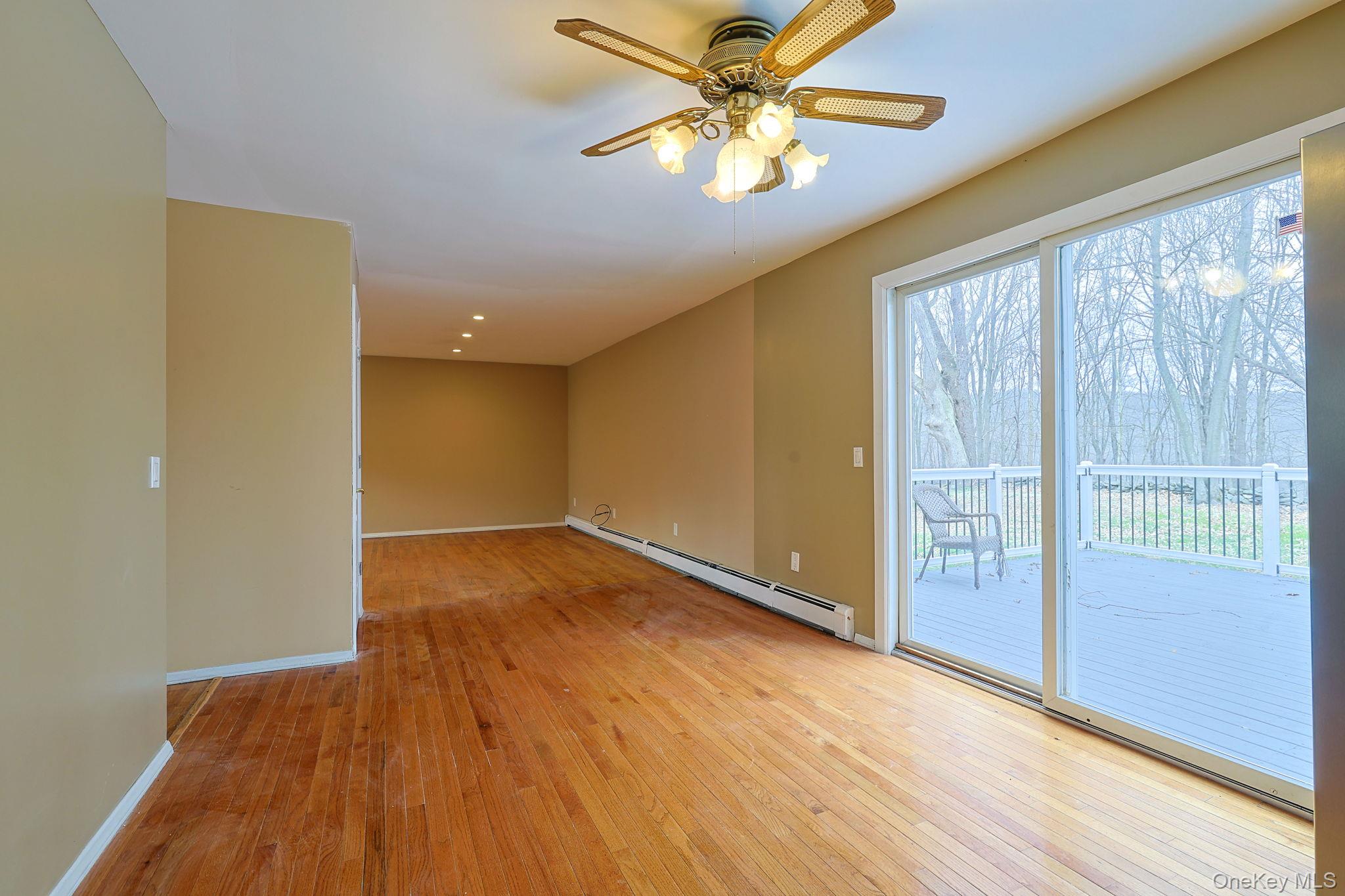 78 Pickerel Road Monroe, NY 10950 - Photo 10 of 41 wooden floor in an empty room with a window