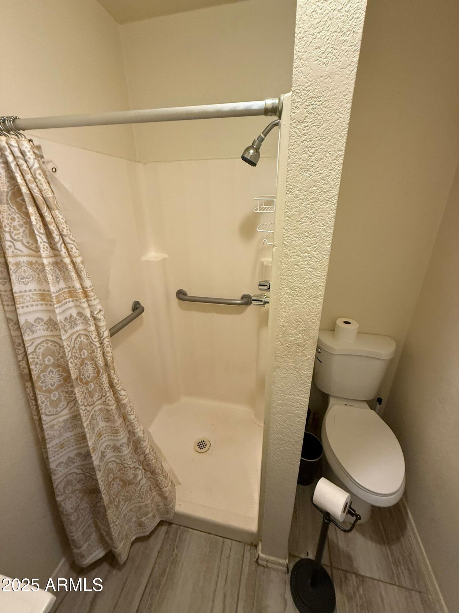 1249 East 10th Street, Unit REAR Douglas, AZ 85607 - Photo 10 of 10 a bathroom with a toilet and a shower