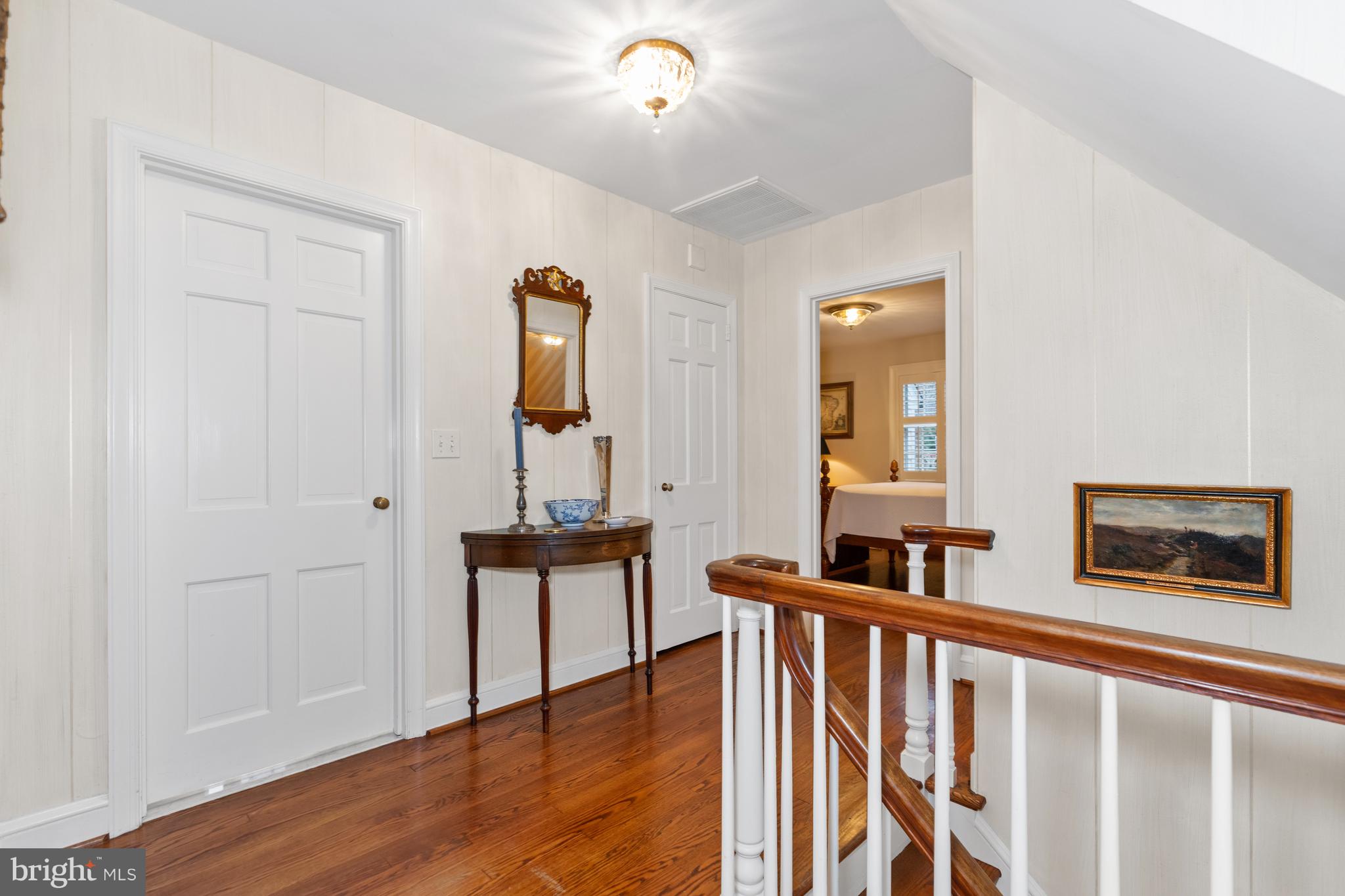 901 Stuart Road Wilmington, DE 19807 - Photo 25 of 58 a view of a hallway with wooden floor and staircase