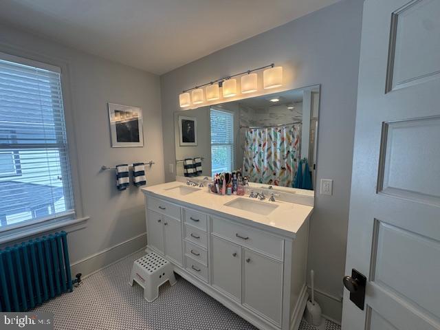 214 West Redman Avenue Haddonfield, NJ 08033 - Photo 16 of 22 a spacious bathroom with a double vanity sink a mirror and a bathtub