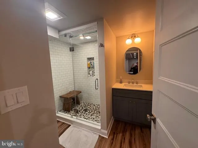 a bathroom with a sink and mirror