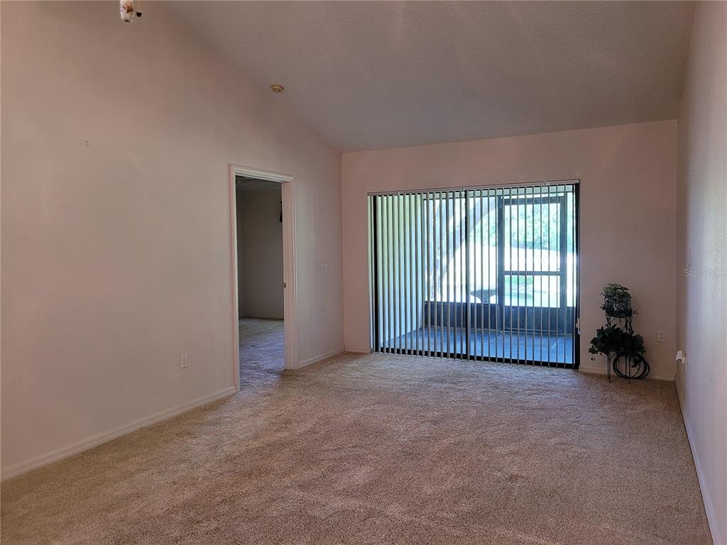 432 Baytree Boulevard Tavares, FL 32778 - Photo 17 of 65 an empty room with windows