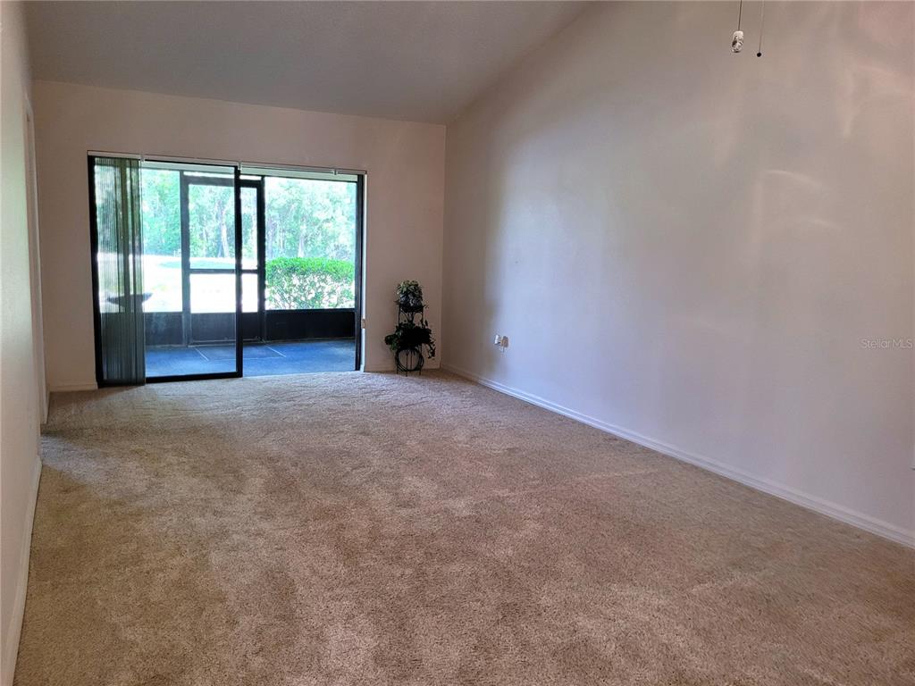 432 Baytree Boulevard Tavares, FL 32778 - Photo 18 of 65 a view of an empty room with a window