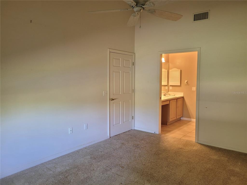 432 Baytree Boulevard Tavares, FL 32778 - Photo 21 of 65 an empty room with a empty space and a ceiling fan
