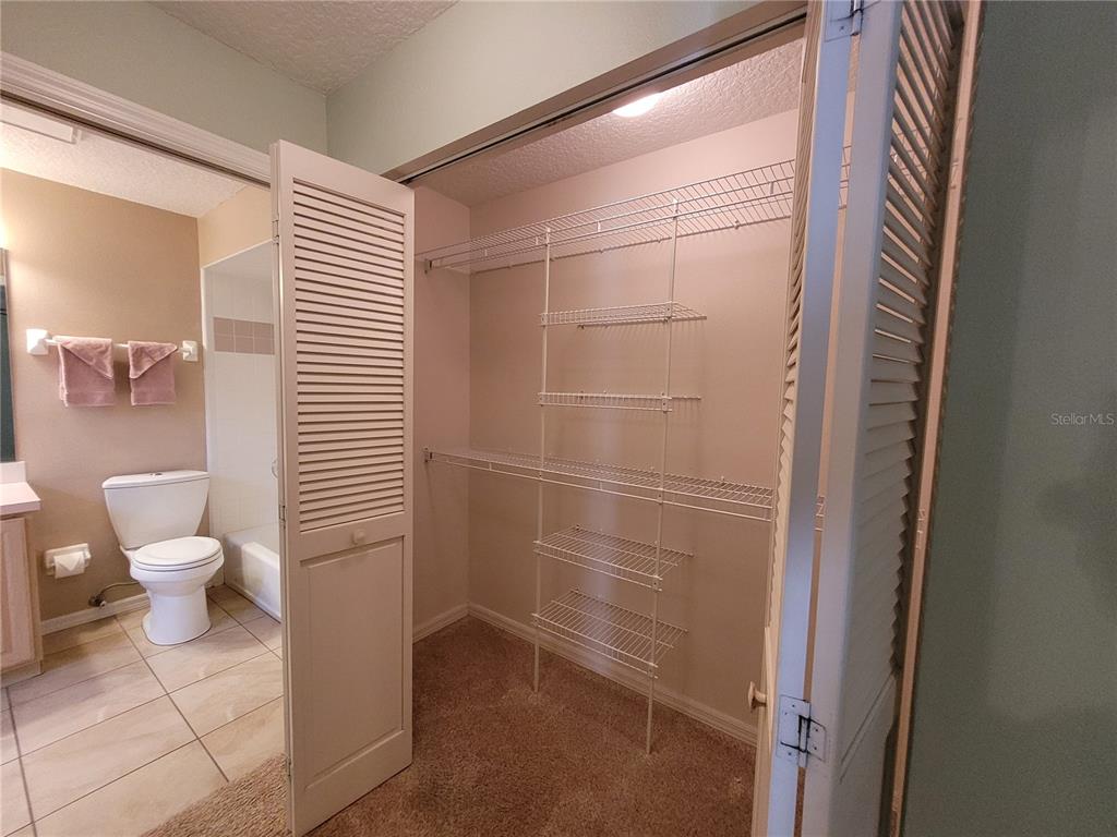 432 Baytree Boulevard Tavares, FL 32778 - Photo 28 of 65 a bathroom with a toilet and a shower