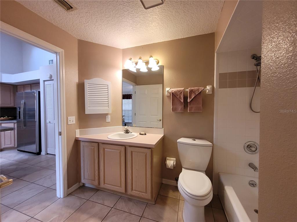 432 Baytree Boulevard Tavares, FL 32778 - Photo 31 of 65 a bathroom with a toilet sink and mirror