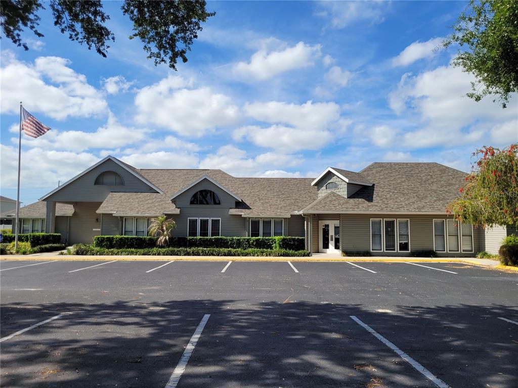 432 Baytree Boulevard Tavares, FL 32778 - Photo 40 of 65 a front view of a house with a yard