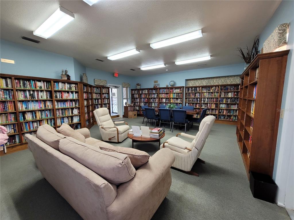 432 Baytree Boulevard Tavares, FL 32778 - Photo 56 of 65 a living room with furniture and a flat screen tv