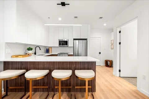 a view of kitchen with breakfast area