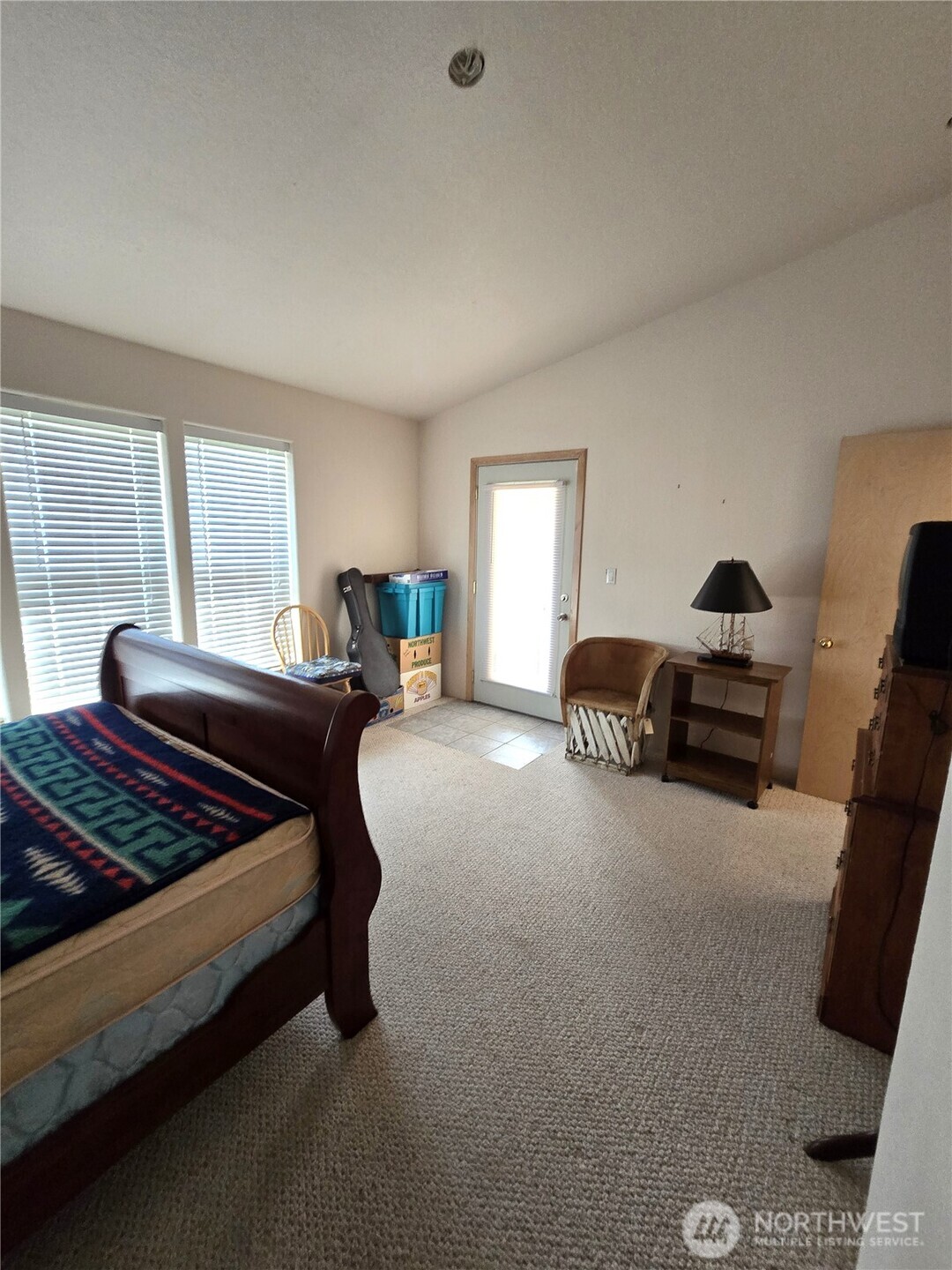 30100 H Street Ocean Park, WA 98640 - Photo 18 of 22 a bedroom with a bed and wooden floor