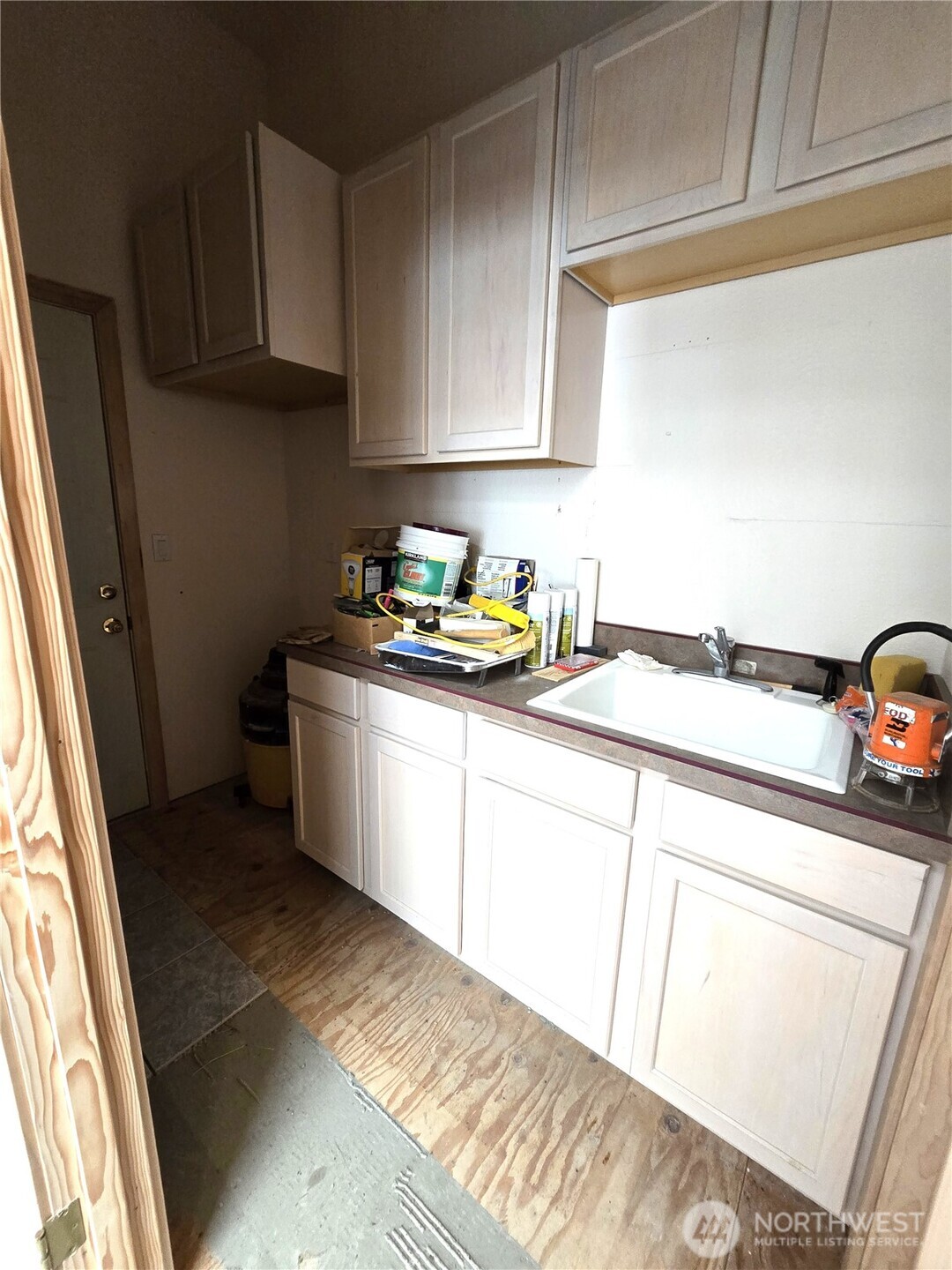 30100 H Street Ocean Park, WA 98640 - Photo 19 of 22 a kitchen with a sink a stove and cabinets