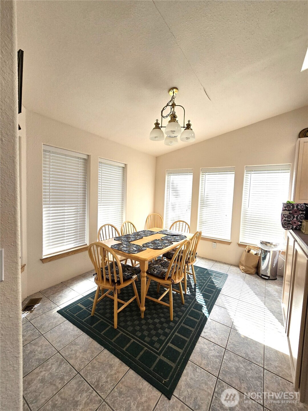 30100 H Street Ocean Park, WA 98640 - Photo 10 of 22 a view of a dining room with furniture and wooden floor