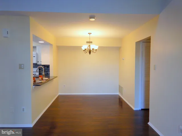 a view of a livingroom with wooden floor