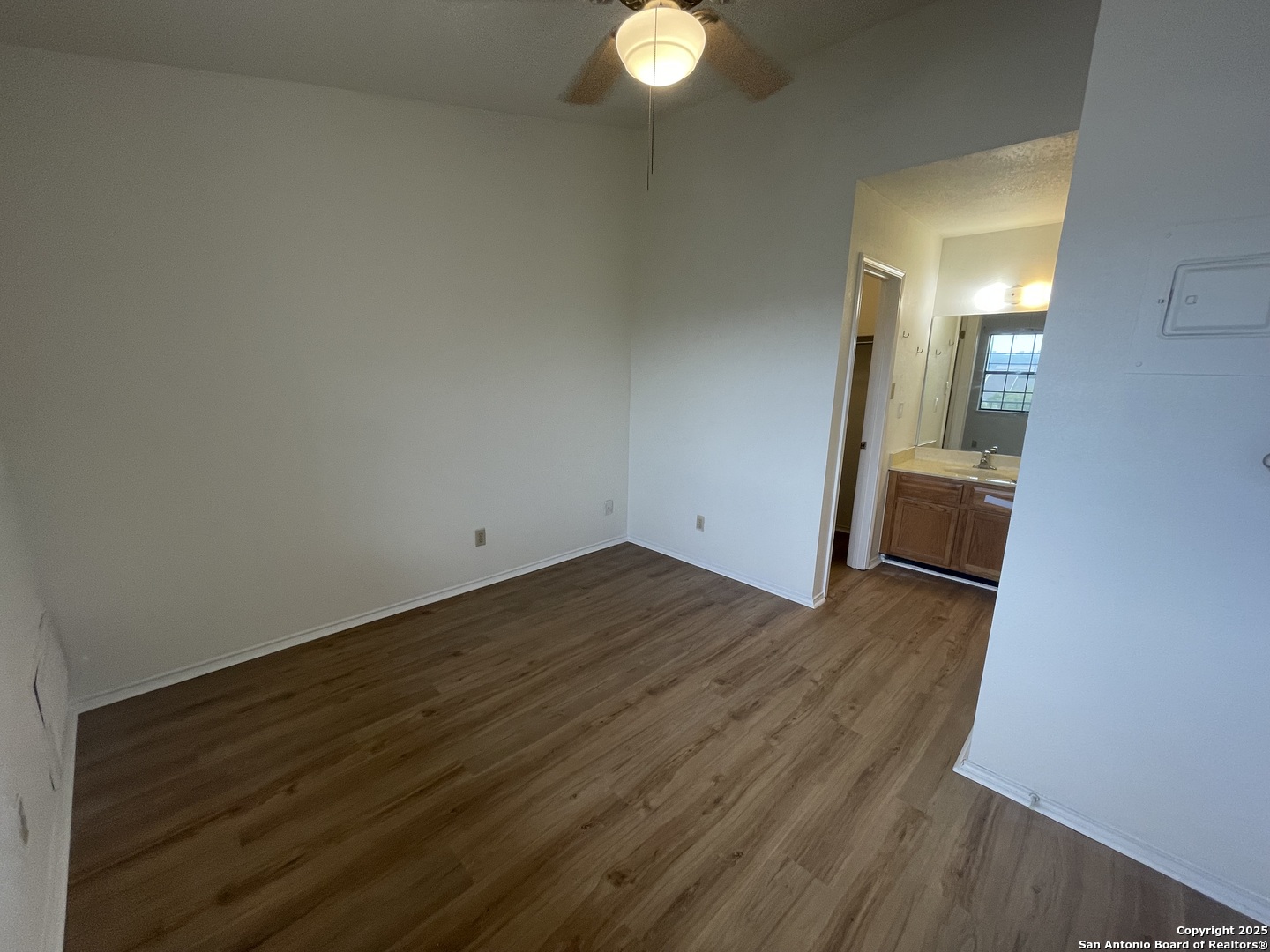 11610 Vance Jackson, Unit 982 San Antonio, TX 78230 - Photo 5 of 9 a view of empty room with wooden floor