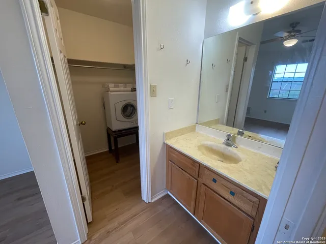 a bathroom with a sink a mirror and a shower