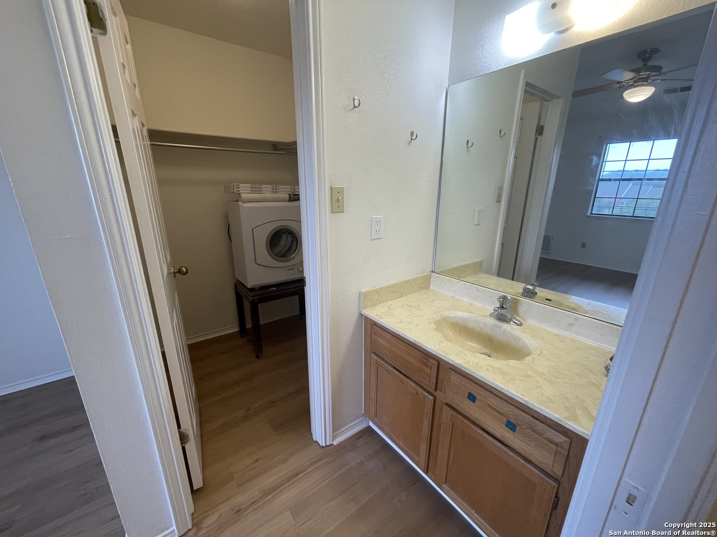 11610 Vance Jackson, Unit 982 San Antonio, TX 78230 - Photo 9 of 9 a bathroom with a sink a mirror and a shower