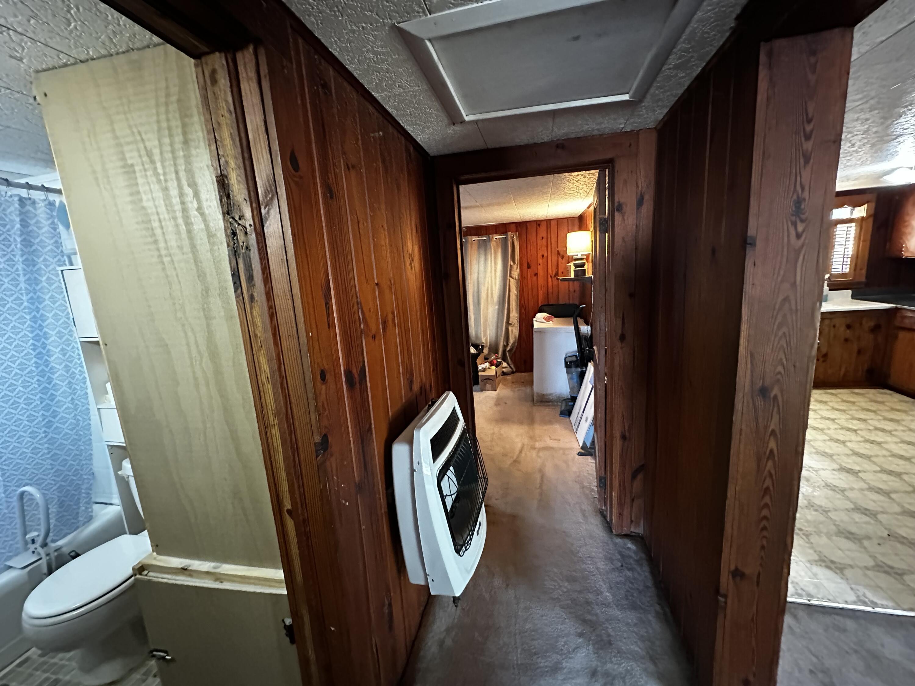 402 Church Street Crestview, FL 32539 - Photo 12 of 18 a view of walk in closet with clothes and shoes