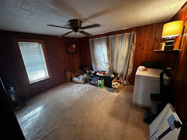 a view of a backyard with large trees