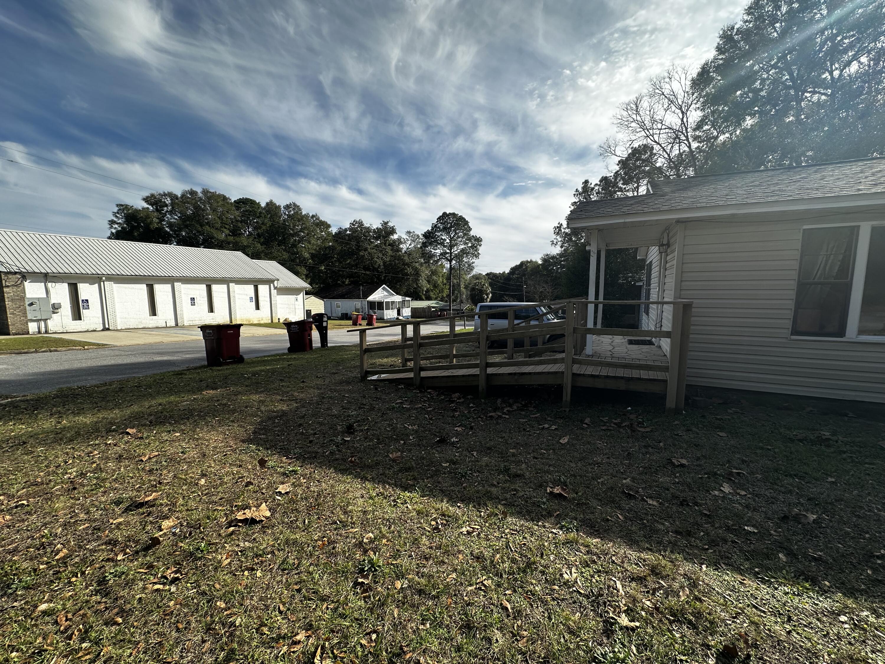 402 Church Street Crestview, FL 32539 - Photo 15 of 18 a view of house with yard and sitting area
