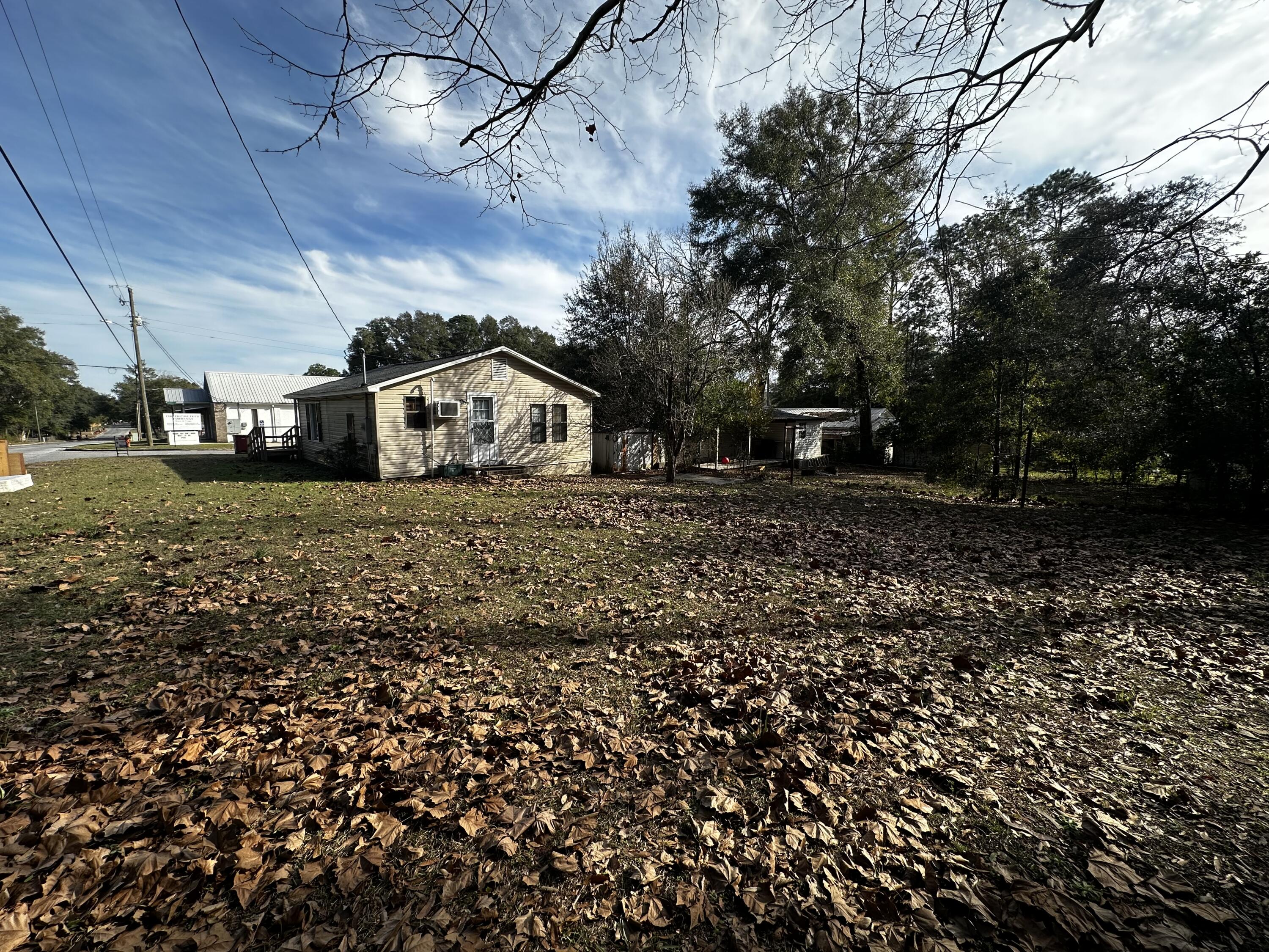 402 Church Street Crestview, FL 32539 - Photo 17 of 18 a view of a house with a yard