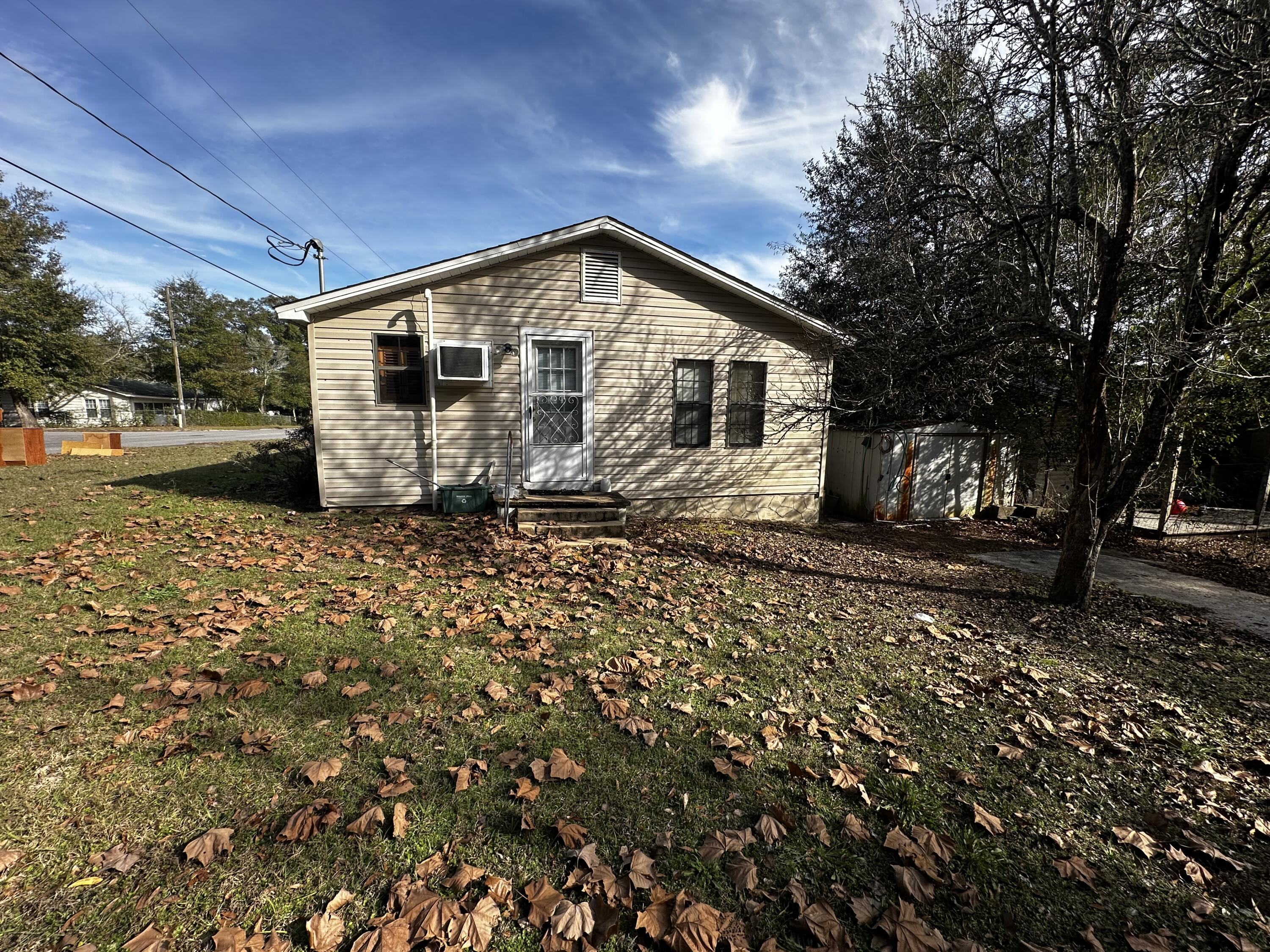 402 Church Street Crestview, FL 32539 - Photo 18 of 18 a view of a house with a yard