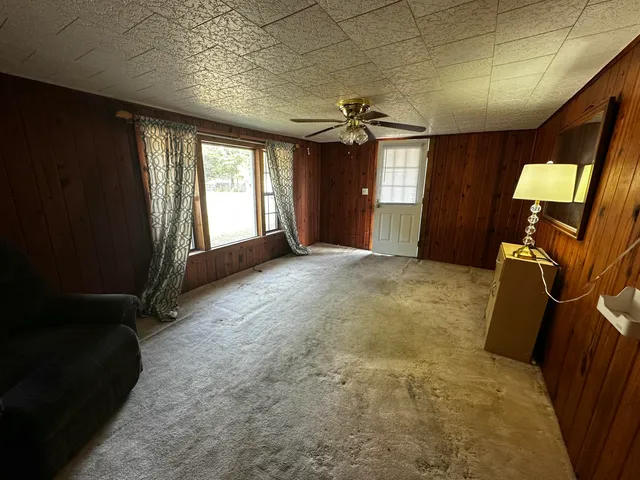 a view of a livingroom with furniture and windows