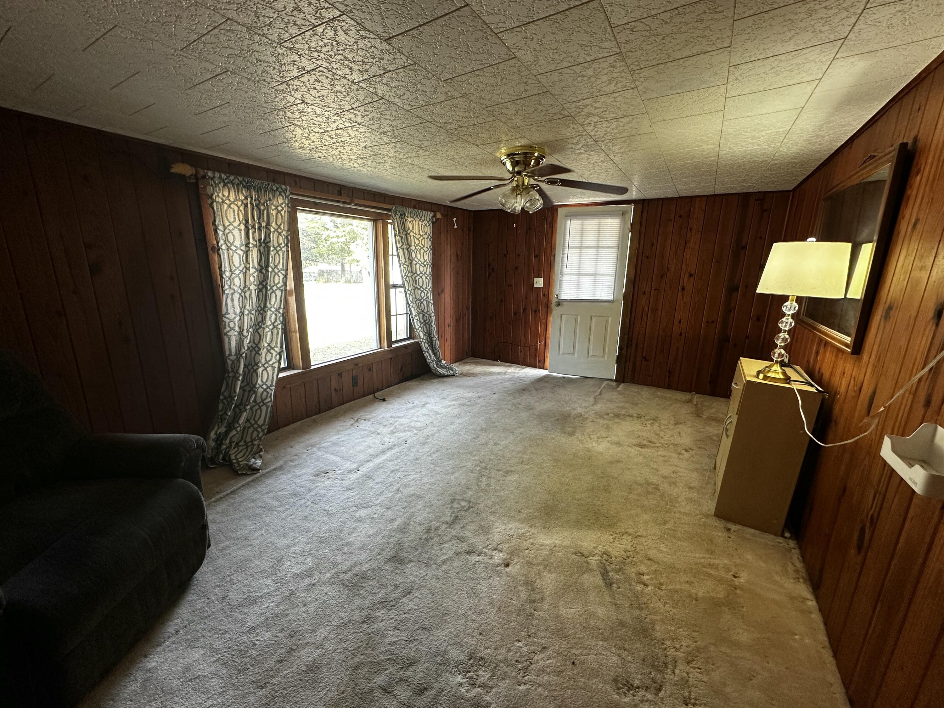 402 Church Street Crestview, FL 32539 - Photo 5 of 18 a view of a livingroom with furniture and windows