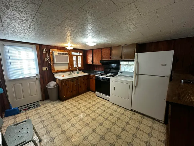 a bathroom with a sink a mirror and a window