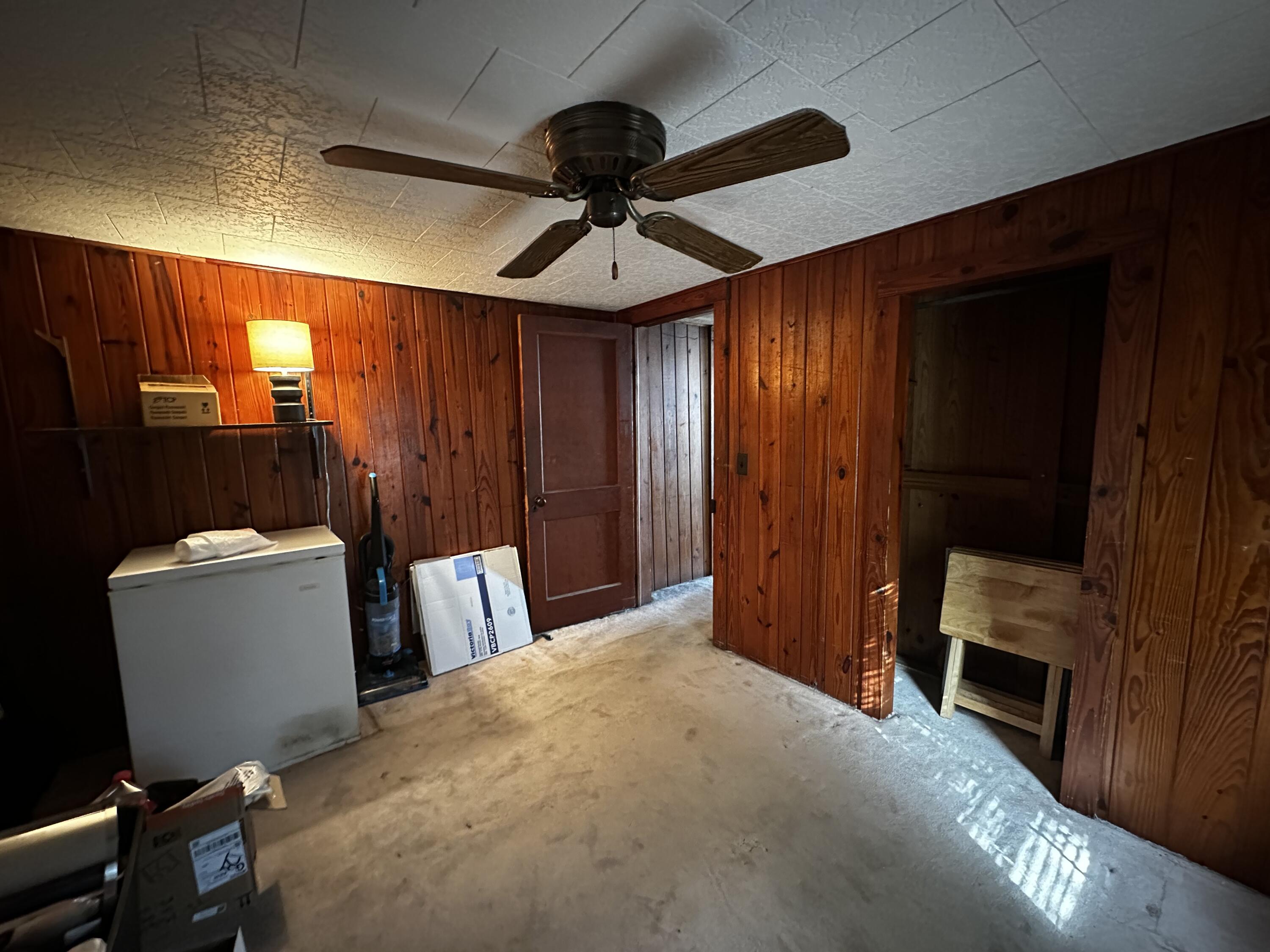402 Church Street Crestview, FL 32539 - Photo 9 of 18 a bed room with a bed and a television