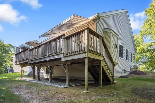 a view of a patio with a table and chairs