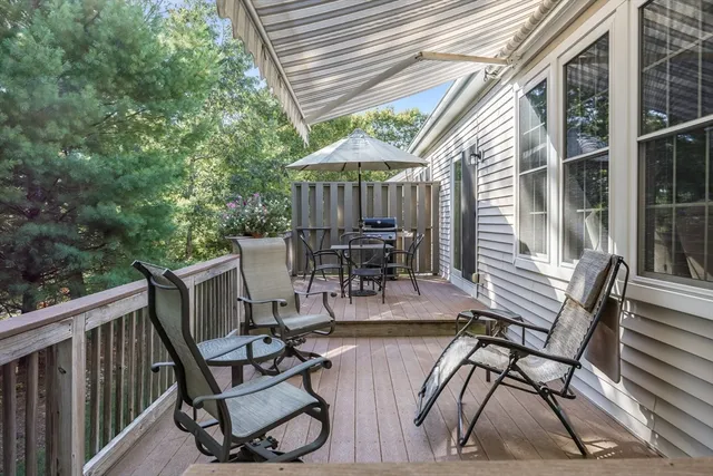 a view of backyard with roof deck and furniture