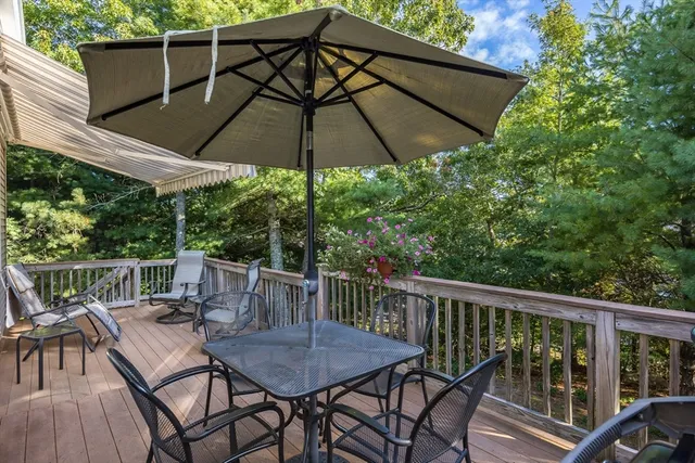 a view of a chair and table in the balcony