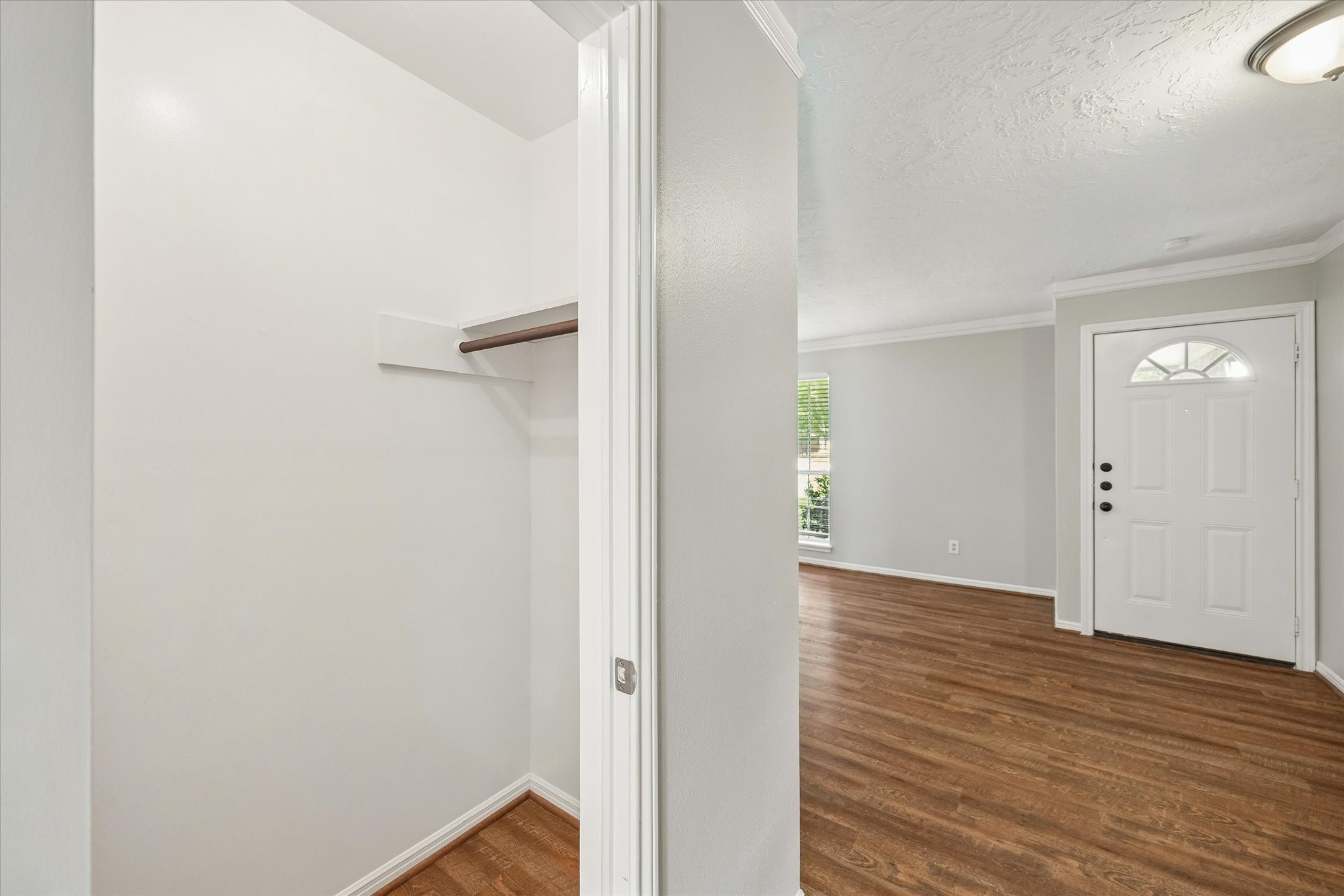 25114 Spring Ridge Drive Spring, TX 77386 - Photo 6 of 24 a view of an empty room with wooden floor and closet