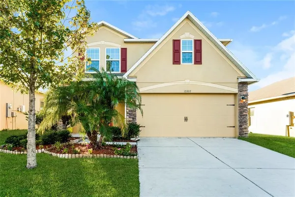 a view of front of house with a yard
