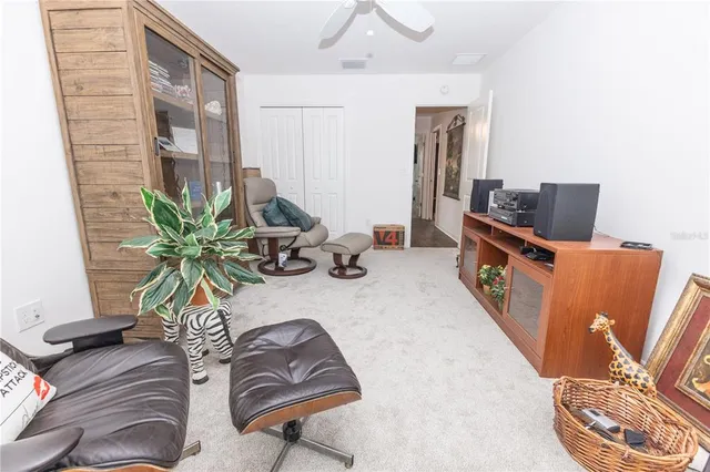 a bedroom with a bed and a night stand