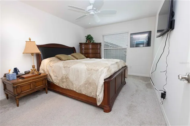 a bathroom with a granite countertop toilet a sink and bathtub